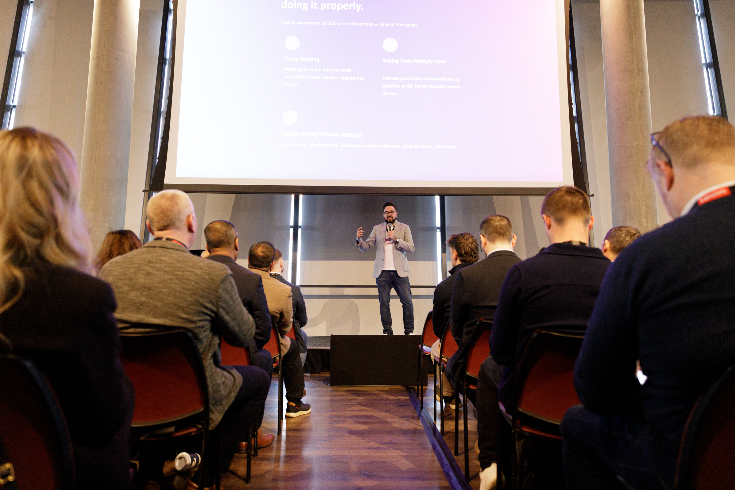 Dan addressing an audience in London